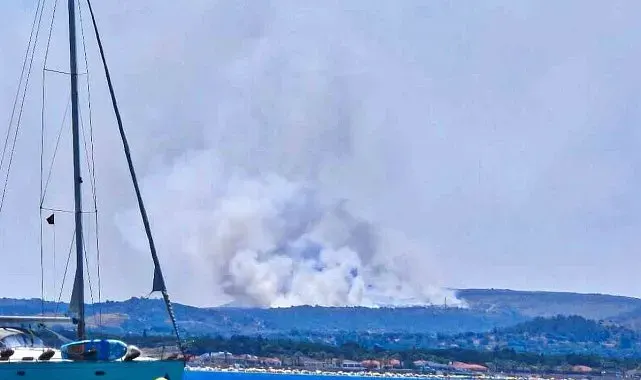 Çeşme'de çöplükte çıkan yangın makilik alana sıçradı